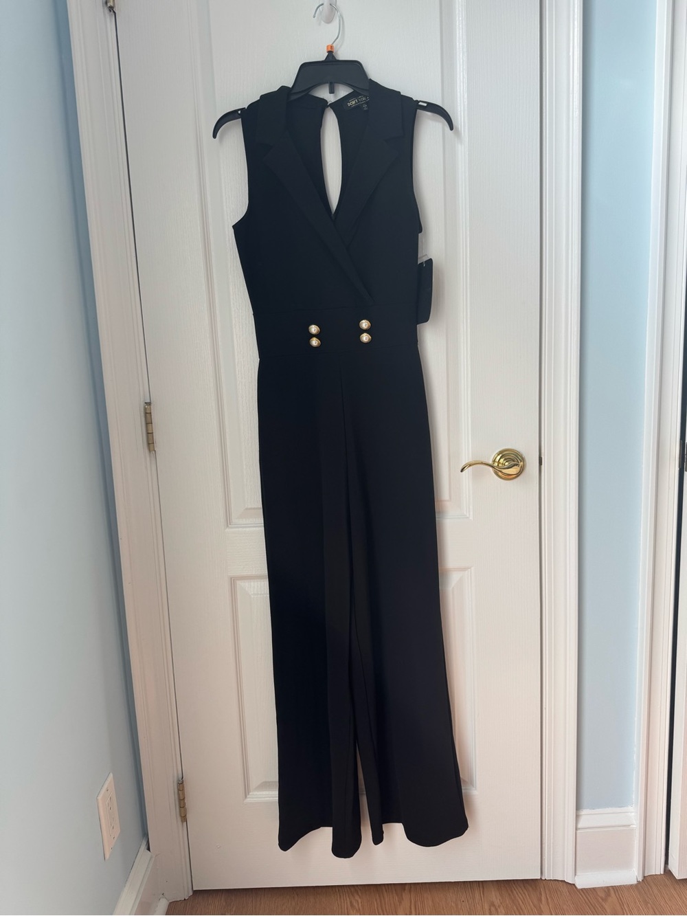 Sleeveless Black Tailored Jumpsuit with Gold Button Accents